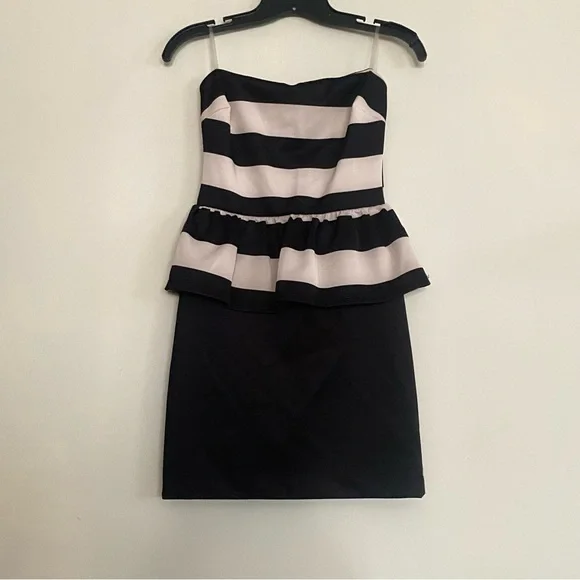 cream and black peplum dress B. Smart Sleeveless Peplum Dress - Cream & Black Colorblock